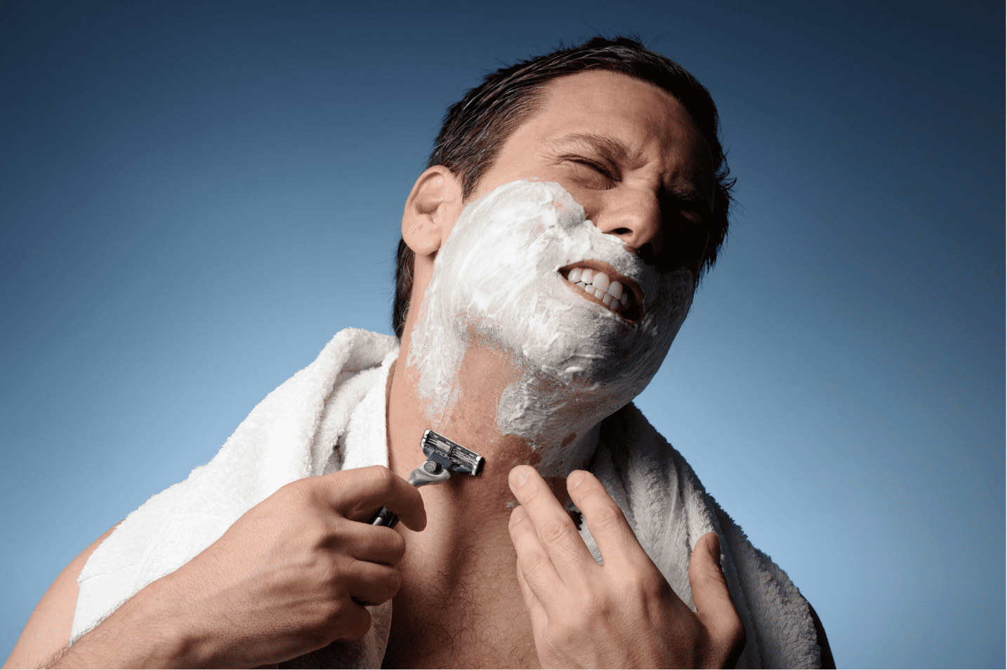 Man shaving with traditional razor